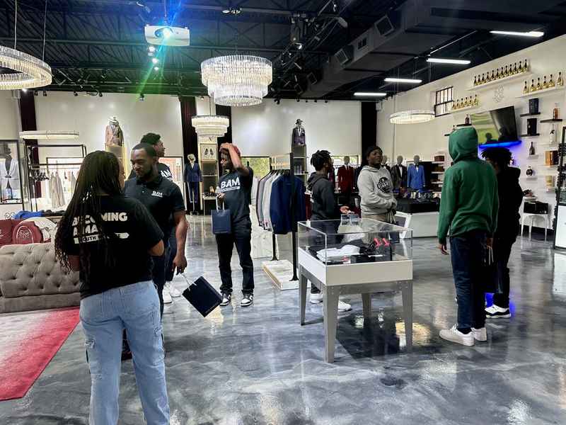 A gallery capturing the Becoming a Man (BAM) Youth Guidance attendees participating in the Dress for Success initiative. — photo 3