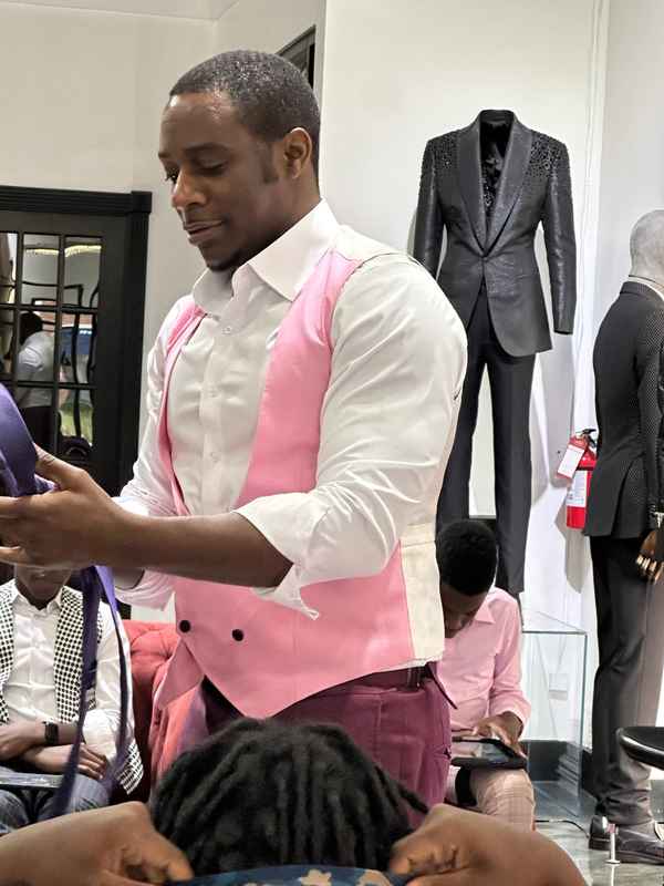 A gallery highlighting the Becoming a Man (BAM) Youth Guidance participants in the Dress for Success initiative, building confidence and career readiness. — photo 4