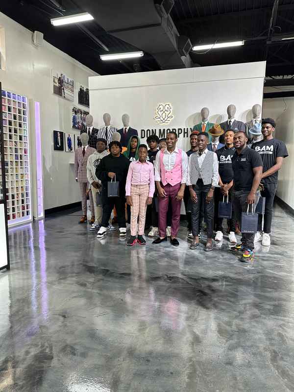 A gallery highlighting the Becoming a Man (BAM) Youth Guidance participants in the Dress for Success initiative, building confidence and career readiness. — photo 6