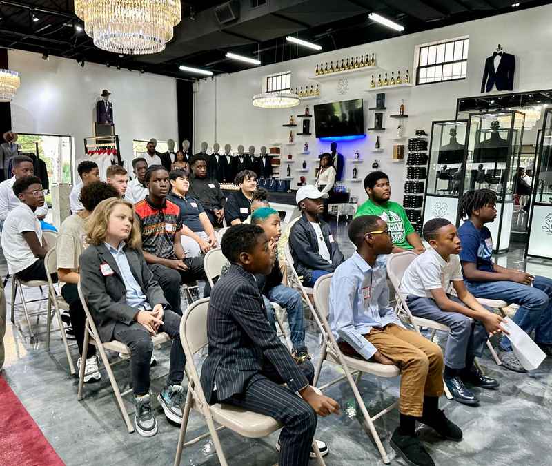 Young participants seated in rows listening to a presentation at a Career Readiness Workshop