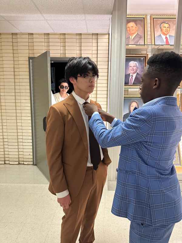 A gallery of students participating in the Dress for Success initiative, featuring their stylish journey on the runway at Skyline High School. &mdash; photo 1