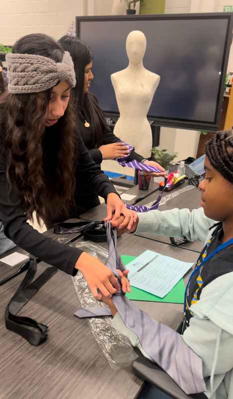 A gallery of students leading a fashion-focused event as part of the Dress for Success initiative at Skyline High School. — photo 2
