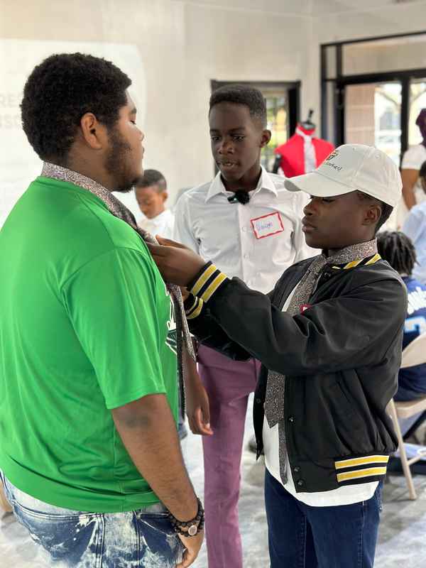 A gallery featuring participants engaging in the Dress for Success initiative, gaining professional attire and career preparation skills at the first monthly Dress-Up Discovery workshop. — photo 1