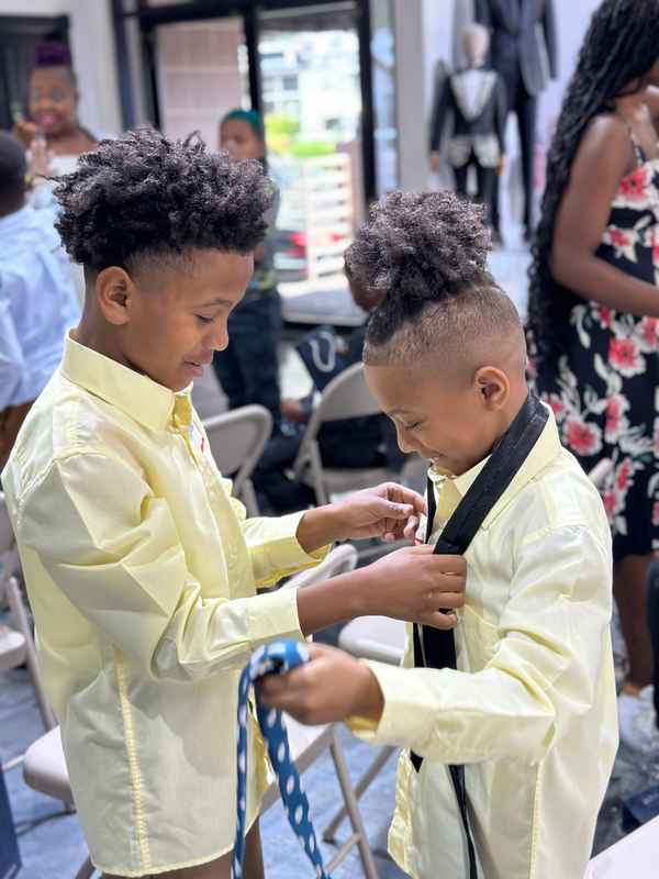 A gallery featuring participants engaging in the Dress for Success initiative, gaining professional attire and career preparation skills at the first monthly Dress-Up Discovery workshop. — photo 3