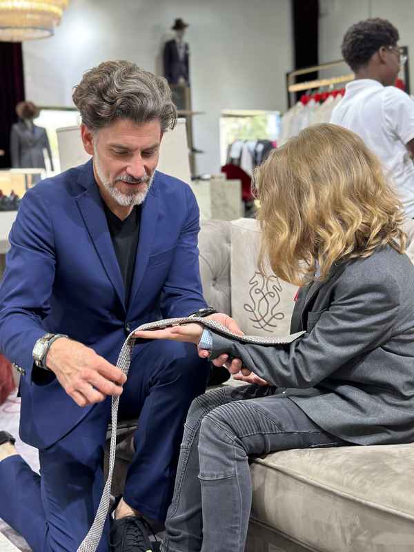 A gallery featuring participants engaging in the Dress for Success initiative, gaining professional attire and career preparation skills at the first monthly Dress-Up Discovery workshop. — photo 4