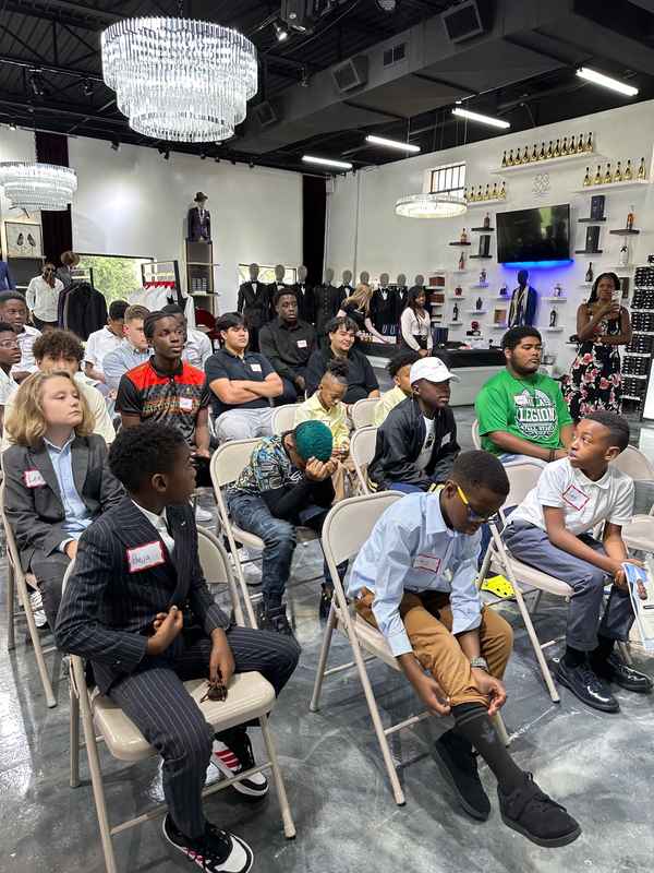 A gallery featuring participants engaging in the Dress for Success initiative, gaining professional attire and career preparation skills at the second monthly Dress-Up Discovery workshop. — photo 2