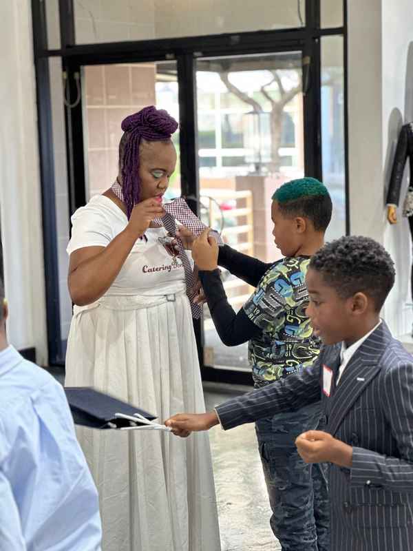 A gallery featuring participants engaging in the Dress for Success initiative, gaining professional attire and career preparation skills at the second monthly Dress-Up Discovery workshop. — photo 3