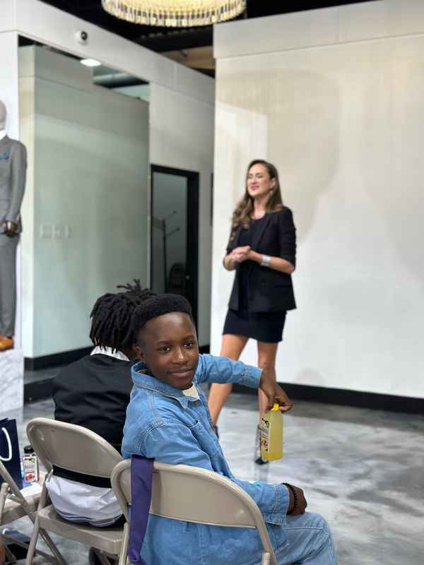 A gallery featuring participants engaging in the Dress for Success initiative, gaining professional attire and career preparation skills at the third monthly Dress-Up Discovery workshop. — photo 2