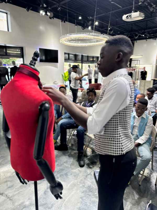 A gallery featuring participants engaging in the Dress for Success initiative, gaining professional attire and career preparation skills at the third monthly Dress-Up Discovery workshop. — photo 3