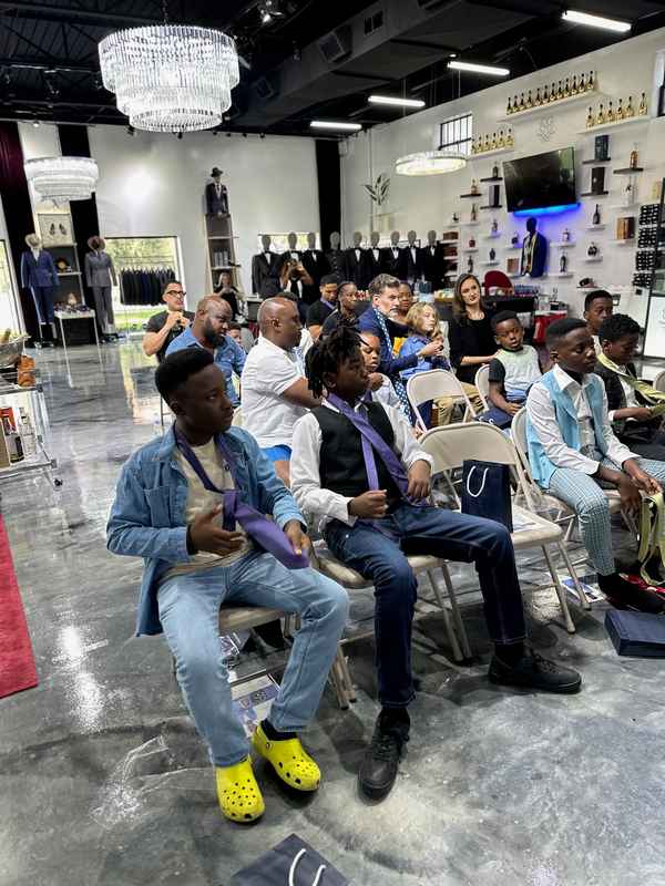 A gallery featuring participants engaging in the Dress for Success initiative, gaining professional attire and career preparation skills at the third monthly Dress-Up Discovery workshop. — photo 4